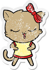 distressed sticker of a cartoon cat with bow on head