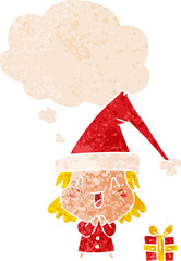 cartoon girl wearing christmas hat and thought bubble in retro textured style