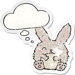 cute cartoon rabbit and thought bubble as a distressed worn sticker