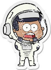distressed sticker of a cartoon surprised astronaut