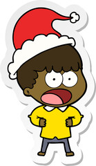 sticker cartoon of a shocked man wearing santa hat