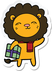 sticker of a cartoon lion with christmas present
