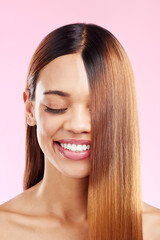 Woman, beauty smile and hair in studio for salon, hairdresser or shine shampoo or treatment. Skincare and makeup glow or hairstyle of aesthetic model on a pink background for self care cosmetics
