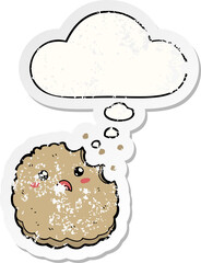 cartoon biscuit and thought bubble as a distressed worn sticker