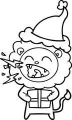 line drawing of a roaring lion with gift wearing santa hat