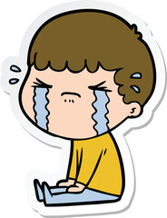 sticker of a cartoon man crying