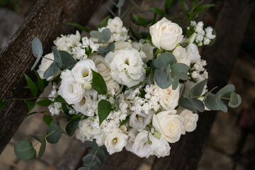 Wedding bouquet of white flowers - ranunculus, freesia, lisianthus.. Wedding. Bride and groom.