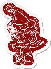 cartoon icon of a happy boy wearing santa hat