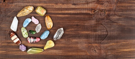 Healing crystal stones in happy spiral shape, alternative therapy or chakra, spiritual banner.