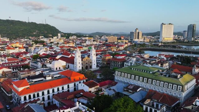DRONE SHOT OF CASCO VIEJO OLD CITY FROM PANAMA WITH THE BASILICA IN THE FRAMEM CERRO ANCON AND PART OF THE SEA 