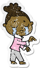 distressed sticker of a cartoon crying woman pointing