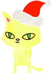 retro cartoon of a cat with bright eyes wearing santa hat