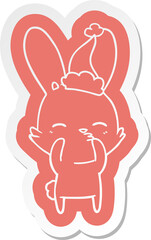 curious bunny cartoon  sticker of a wearing santa hat
