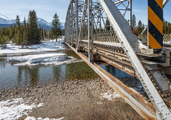 Old steel truss bridge over the Bow River at Castle Junction in Banff National Park, Alberta, Canada