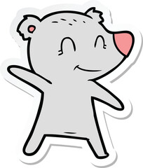 sticker of a smiling bear pointing