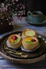 choux cream fruit, kue soes in dark background