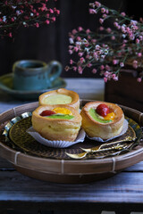 choux cream fruit, kue soes in dark background