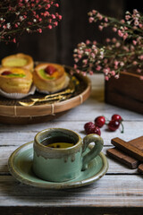 a cup of tea with choux pastry on the table