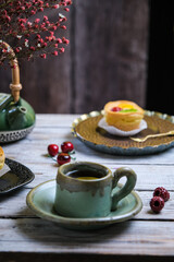 a cup of tea with choux pastry on the table