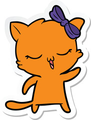 Obraz na płótnie Canvas sticker of a cartoon cat with bow on head