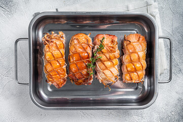 Baked Chicken breasts stuffed with cheese and bacon. White background. Top view