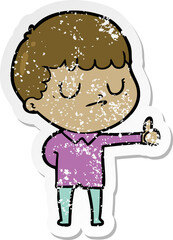 distressed sticker of a cartoon grumpy boy