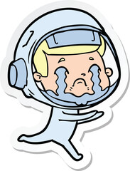 Obraz premium sticker of a cartoon crying astronaut
