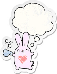 cute cartoon rabbit with love heart and coffee cup and thought bubble as a distressed worn sticker