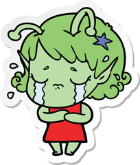 sticker of a cartoon crying alien girl