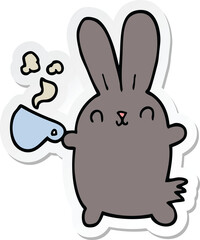 sticker of a cute cartoon rabbit with coffee cup
