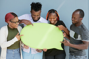 Young african american friends holding up copyspace placard thought bubbles