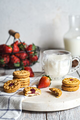 strawberry cookies and milk on tray