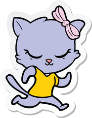 sticker of a cute cartoon cat with bow