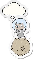 cute cartoon astronaut cat and thought bubble as a printed sticker