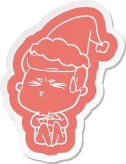 cartoon  sticker of a man sweating wearing santa hat