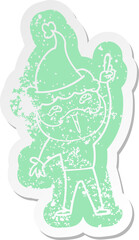 cartoon distressed sticker of a happy bearded man wearing santa hat