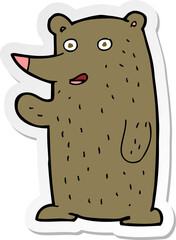 sticker of a cartoon waving bear