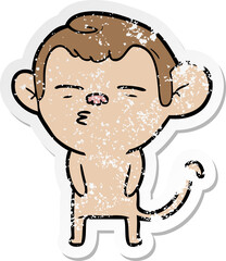 distressed sticker of a cartoon suspicious monkey