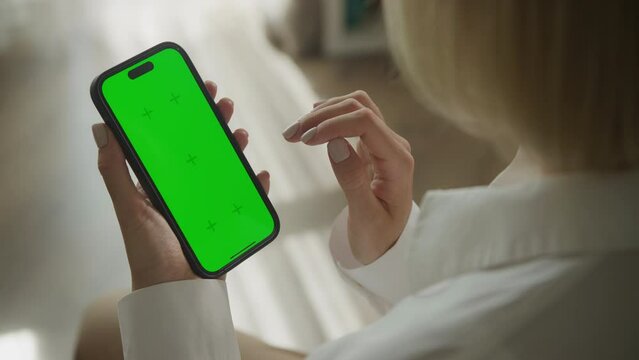 Single tap on smartphone with green screen in notifications area