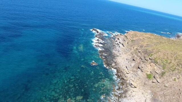 aerial shot by drone of the cliffs of bejaia overlooking the mediterranean sea