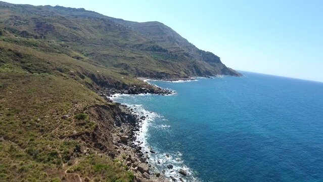 aerial shot by drone of the mountains of bejaia which overlooks the mediterranean sea