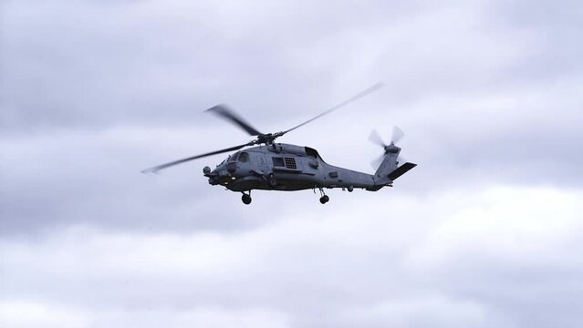 MH-60R Seahawk Helicopter Flying In The Sky - low angle