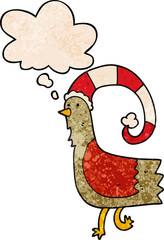 cartoon chicken in funny christmas hat and thought bubble in grunge texture pattern style