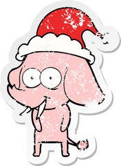 happy distressed sticker cartoon of a elephant wearing santa hat