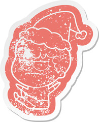 cartoon distressed sticker of a annoyed man wearing santa hat