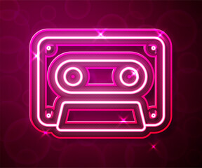 Glowing neon line Retro audio cassette tape icon isolated on red background. Vector