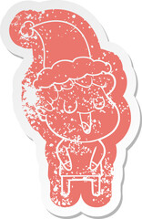 laughing cartoon distressed sticker of a man wearing santa hat