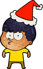 textured cartoon of a curious boy wearing santa hat