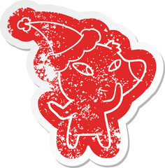 cute cartoon distressed sticker of a bear wearing santa hat