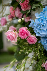 Beautiful Wedding ceremony event. Outdoor wedding arch. Green and white wedding decorations. Wedding day.